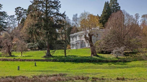 The exterior of the house at Parke surrounded by the gardens in spring